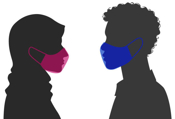 Side view of male and female silhouette wearing mask