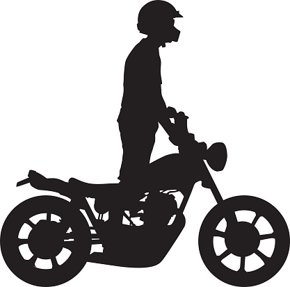 Vector silhouette of a man riding a motorcycle while standing up. vector