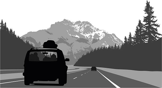 Road Trip Through The Mountains A vector silhouette illustration of a loaded van driving along the highwat through the Rocky Mountains. road silhouettes stock illustrations