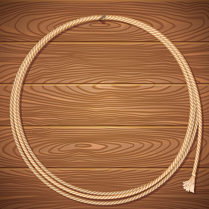 Rope lasso on wood background