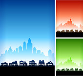. This royalty free vector illustration features a silhouette of residential buildings and homes in the foreground with a cityscape set in the background. The image includes three variation, the main one in blue with alternate version in red and in green on the right. Each house or building can be used independently. There is also plenty of space for copy. Architectural details such as doors and windows make this a perfect option for your neighborhood announcements.