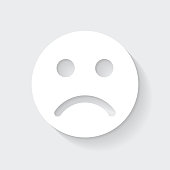 istock Sad face emoji. Icon with long shadow on blank background - Flat Design 1375946831