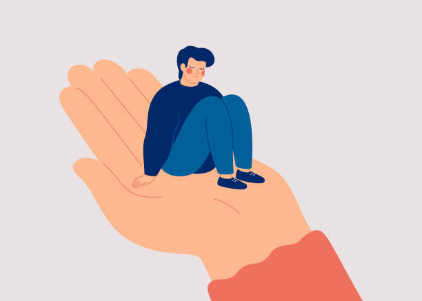Sad man sits on the big human hand and needs care and support. Counselor helps a lonely teenager boy to get rid of depression. vector art illustration