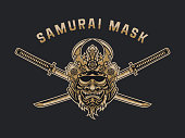 Stylized Japanese samurai monster mask with crossed katanas vector emblem