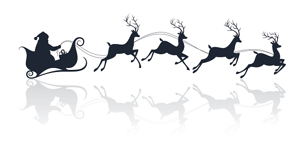 Santa Claus silhouette riding a sleigh with deers