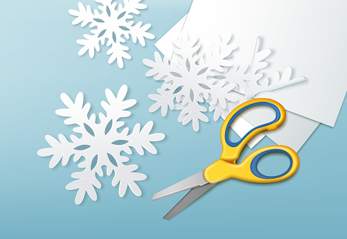 Scissors and paper snowflakes