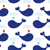 istock Seamless pattern with cute navy blue whales with hearts and waves. Vector sea background for kids. Child drawing style cartoon baby animals underwater illustration. Design for fabric, decor. 1314089480