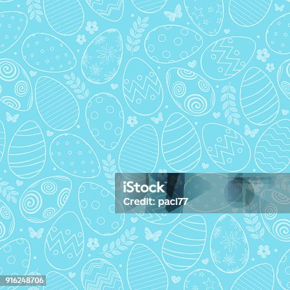 istock Seamless pattern with Easter eggs, flowers and butterfly on blue background 916248706