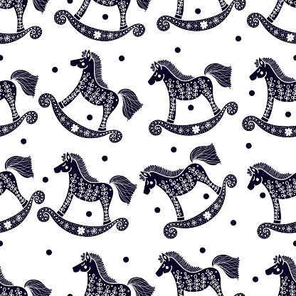 Seamless pattern with rocking horses.