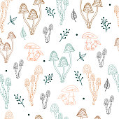 istock Seamless pattern with simple small mushrooms and plants in pastel colors. Autumn repeating background. Cute baby print. Vector illustration in scandinavian decorative doodle style 1407265896