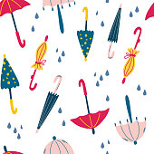 istock Seamless pattern with umbrellas and raindrops. Fashionable clothes in bad weather. Scandinavian style background. Decorative wallpaper or pack paper, good for printing. Vector illustration 1330152795