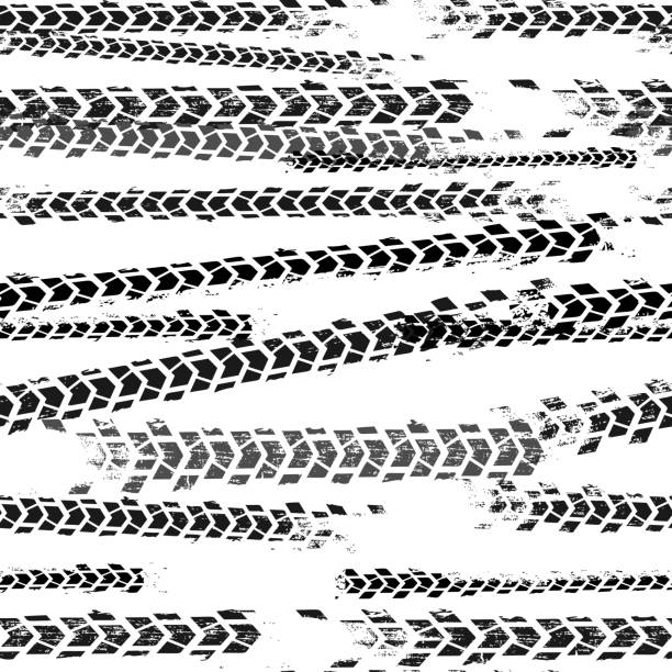 Seamless Tire Tracks Pattern Automobile and motorcycle tire tracks seamless pattern. Grunge automotive addon useful for poster, print, brochure and leaflet background design. Editable vector illustration in monochrome colors. skid mark stock illustrations