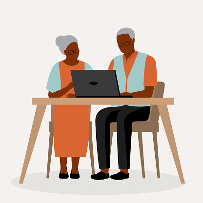 Senior Black Couple Using Laptop.