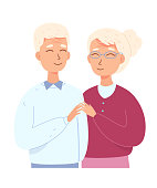 istock Senior couple retirees standing together, portrait of smiling old people with grey hair 1365127493