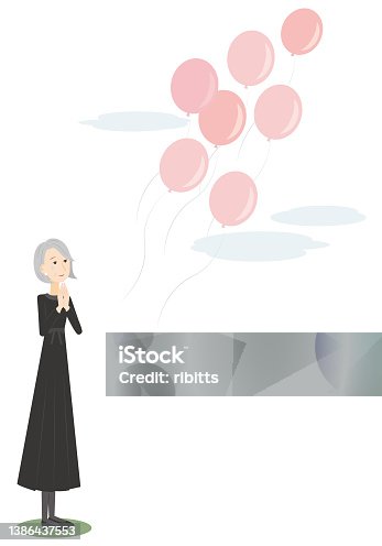 istock Senior woman doing balloon funeral 1386437553