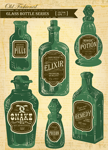 Set of assorted old fashioned labels with bottle on paper