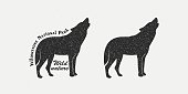 istock Set of black silhouettes of a wolf, text with texture on a gray background. 1307563469