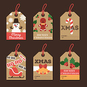 Set of Merry Christmas and Happy New Year Gift Tags. Retro Design with Holiday Signs and Symbols on Cardboard Paper. Vector Illustration.