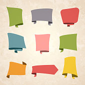 Set of Vintage multicolored banners (Red, orange, yellow, green, blue, gray, pink), in speech bubble style, isolated on a brown retro background with an effect of old textured paper. Elements for your design, with space for your text. Vector Illustration (EPS10, well layered and grouped). Easy to edit, manipulate, resize or colorize.