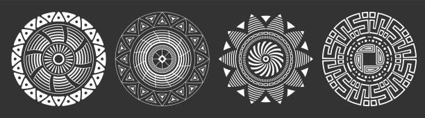 Set of four abstract circular ornaments. Decorative patterns isolated on black background. Set of four abstract circular ornaments. Decorative patterns isolated on black background. Tribal ethnic motifs. Stylized sun symbols. Stencil tattoo and prints Vector monochrome illustration. african culture stock illustrations