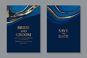 Set of two cards with liquid marble and golden waves on a navy blue background.