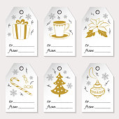 A set of six Christmas or New Year gift tags with holiday icons and winter symbols. Golden elements isolated on white background. Used for your design, scrapbook, wrapping, sale. Vector illustration.