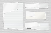 Set of torn white and lined note, notebook paper strips and pieces stuck on light squared background. Vector illustration.