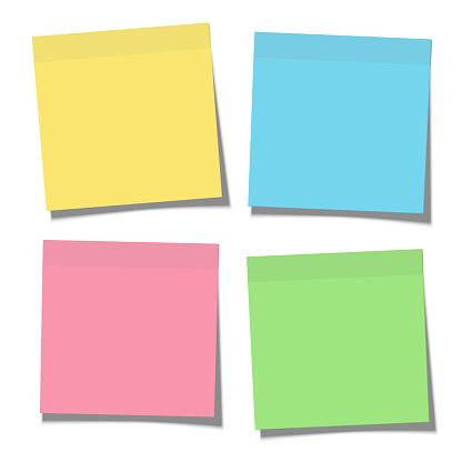 Set of yellow, green, blue and pink paper sticky notes glued to the surface isolated on white