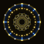 Shiny circle with mandala on black background.