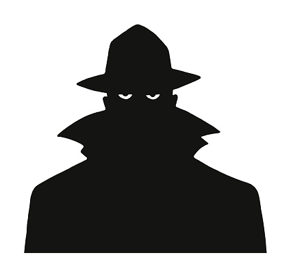 Silhouette of a Man in a Trench Coat and Hat