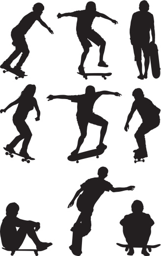 Silhouette of people skateboarding