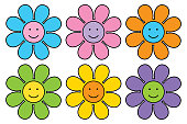 Vector illustration of six cute colorful smiling flowers on a white background.