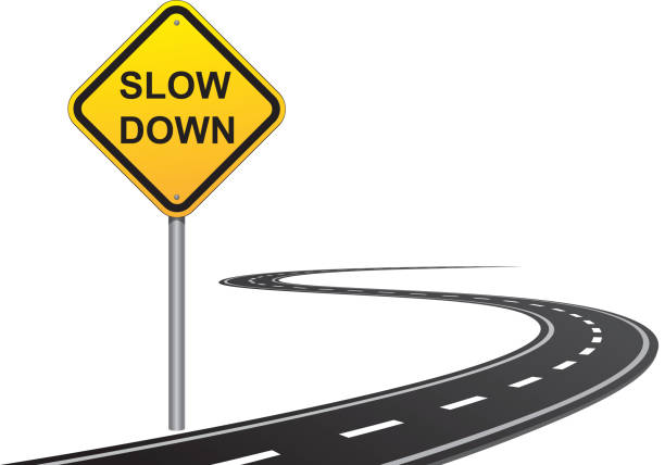 slow down road sign - ağır çekim stock illustrations