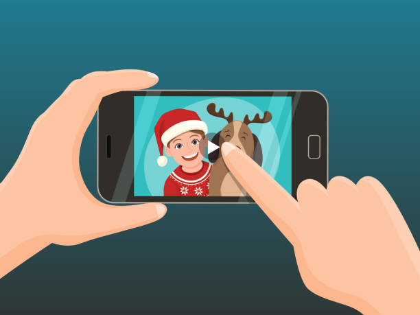 ilustrações de stock, clip art, desenhos animados e ícones de smartphone with a christmas video for greeting. - smartphone christmas