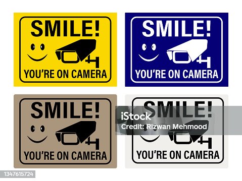 istock Smile you're on camera. Video Surveillance Signs. You are on camera signs and stickers. 1347615724