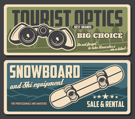 Snowboard and binoculars of tourism equipment