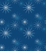 Snowflakes. Winter seamless pattern of colorful snowflakes on blue background. Abstract vector illustration