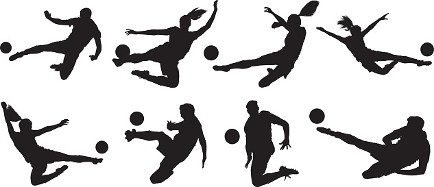 Soccer players kicking the ball
