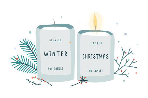 Soy candle in glass jar decorated with fir branches, soy wax scented with christmas and winter mood scent.