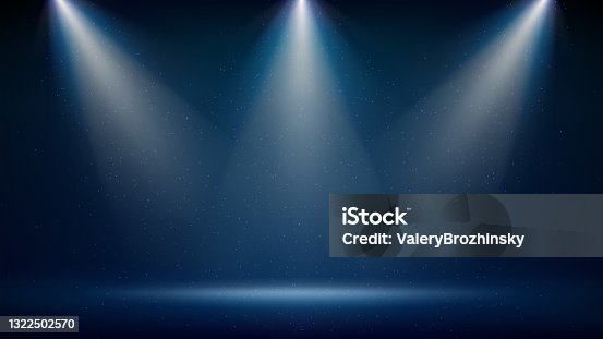istock Spotlight backdrop. Illuminated blue stage. Background for displaying products. Bright beams of spotlights, shimmering glittering particles, a spot of light. Vector illustration 1322502570