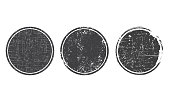 Set of grunge round black post stamps. Blank vector shapes with distress textures