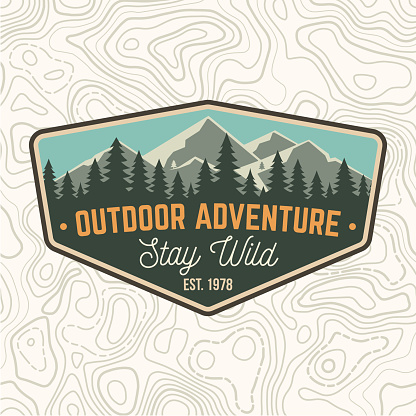 Stay wild, outdoor adventure patch. Vector illustration. Concept for shirt or print, stamp or tee. Vintage typography design with mountains and forest silhouette. Outdoor adventure badge.