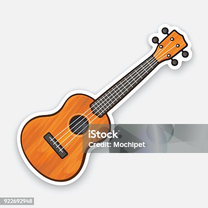 istock Sticker of small classical wooden guitar 922692948