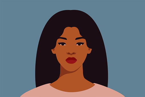 Strong Black woman with long dark hair looks directly. Confident young woman with brown skin portrait front view on a blue background.