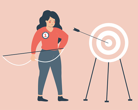 Strong girl shooting a bow and hits the target. Businesswoman achieve her goals in career and life. Woman hits the bull's eye of the dartboard.