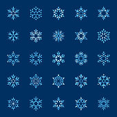 Set of stylized snowflakes. Vector design elements, icon set. Collection of different variations. Blue snowflakes on dark background.