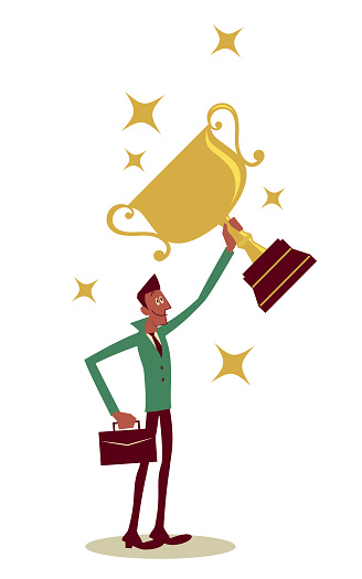 Successful businessman lifting a trophy