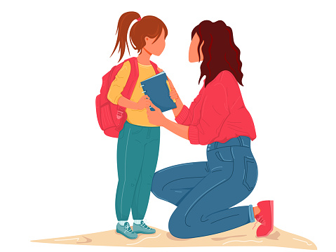 Supportive mother with her little schoolgirl on first day school
