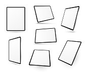 Tablet computers in different positions realistic mock ups set. Top, side, three quater, perspective view. Mobile devices with touchscreen display. Copy space. Vector templates collection on white.