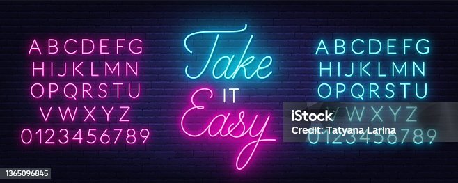 istock Take it Easy neon quote on a brick wall. 1365096845